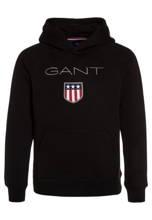 Schwarzer Kapuzenpullover mit Fronttasche, Text "GANT" über einem Wappen mit drei weißen Sternen und rot-weißen Streifen.