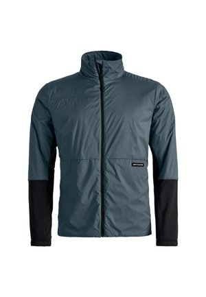Lightweight, insulated jacket in dark teal with a high collar and black long sleeves. Features a front zipper and logo on the left side.