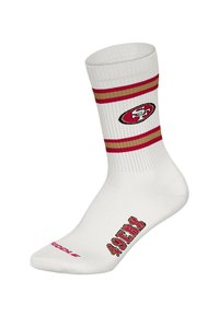Biała skarpetka z czerwonymi i złotymi paskami, z logo i napisem „49ERS” w czerwonym kolorze z boku. Wykonana z elastycznego materiału zapewniającego dopasowanie.