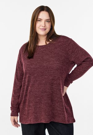 Marl-patterned burgundy long-sleeve top with a round neckline and relaxed fit, made from a soft, textured fabric.