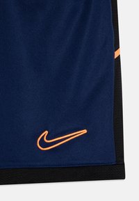 Nike Performance UNISEX - Pantalón corto de deporte - blue void/black/orange pulse