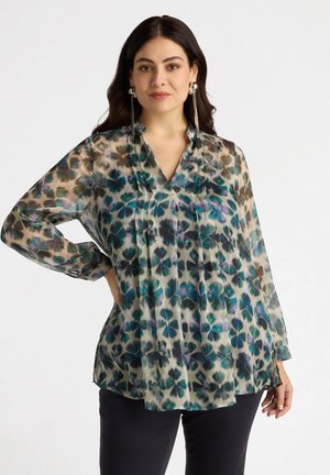 Sheer blouse in pastel colors with a floral pattern. Features a collar, long sleeves, and pleated detailing along the front.