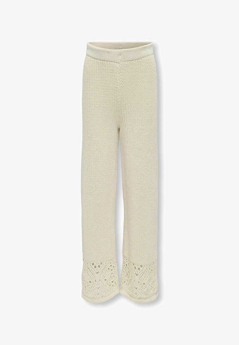 Pantalon beige en tricot avec une finition texturée et un bord en dentelle, offrant une coupe décontractée et un matériau doux et respirant.