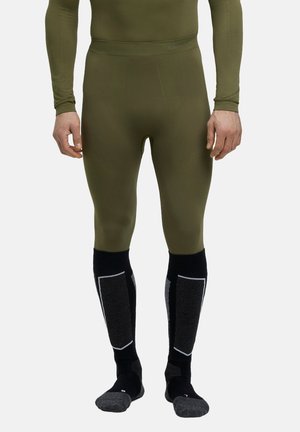 Collants de base ajustés verts avec des détails texturés. Chaussettes noires montantes avec des accents et des panneaux gris. Tissu doux et extensible.