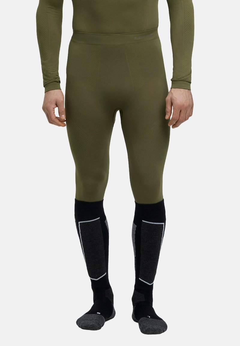 Collants de base ajustés verts avec des détails texturés. Chaussettes noires montantes avec des accents et des panneaux gris. Tissu doux et extensible.