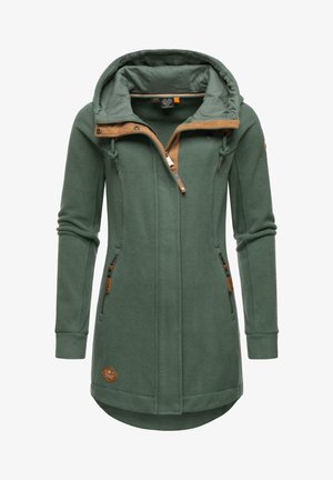 Green fleece jacket with a slightly curved hem, front zip, two side pockets, and a tan accent around the hood and zipper area.
