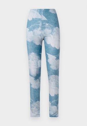 Leggings featuring a blue denim background with white cloud patterns. The fabric appears stretchy with a fitted design and ankle length.