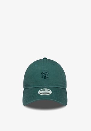 Dark green adjustable baseball cap with embroidered New York Yankees logo on front and a branded sticker on the brim.
