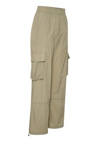 Pantalon cargo beige avec taille élastique, poches à rabat latérales et ourlets à cordon de serrage réglable.