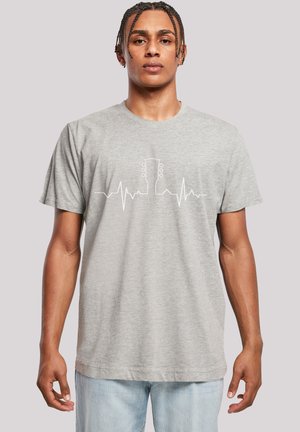 Short-sleeve gray t-shirt made of cotton, featuring a white heartbeat line design with a guitar outline at the center.