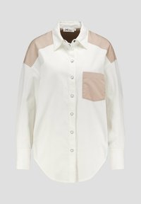 Witte blouse met beige schouderaccenten en zak, met een doorlopende knoopsluiting en lange mouwen. Gemaakt van een gladde stof met een gestructureerde afwerking.