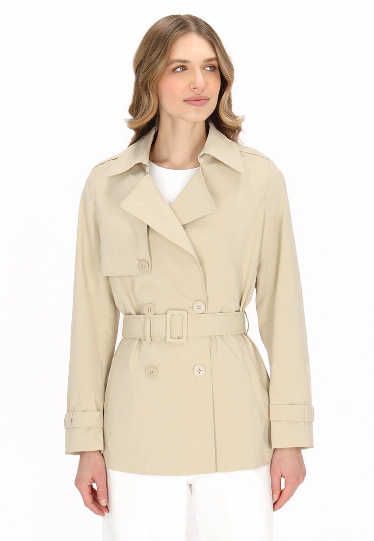 Beige trench coat with double-breasted buttons, a waist belt, and a notched collar. Smooth texture, long sleeves with buttoned cuffs.