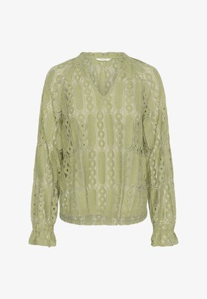 Hele roheline pluus V-kaelusega, pikkade varrukatega ja peente pitsdetailidega, mis sisaldavad ringikujulisi mustreid ja lainelisi mansette.