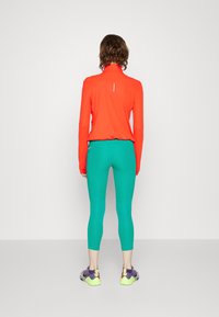 Nike Performance FAST CROP - Leggings - neptune green/(reflective silv)