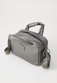 Silver metallic small bag with a zip closure, two carry handles, and an adjustable strap. Features a logo on the front.