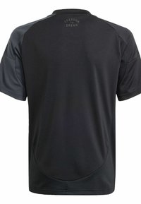 Schwarz sportliches Trikot mit kurzen Ärmeln, ausgestattet mit einem grauen Schulterakzent und einem runden "Freedom to Dream"-Logo auf dem oberen Rücken.