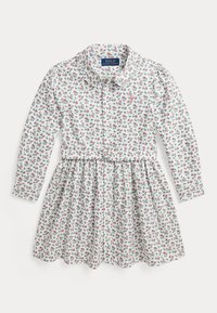 White long-sleeve dress with a floral pattern in red and green, featuring a collared neck and a fitted waist with a circular belt detail.