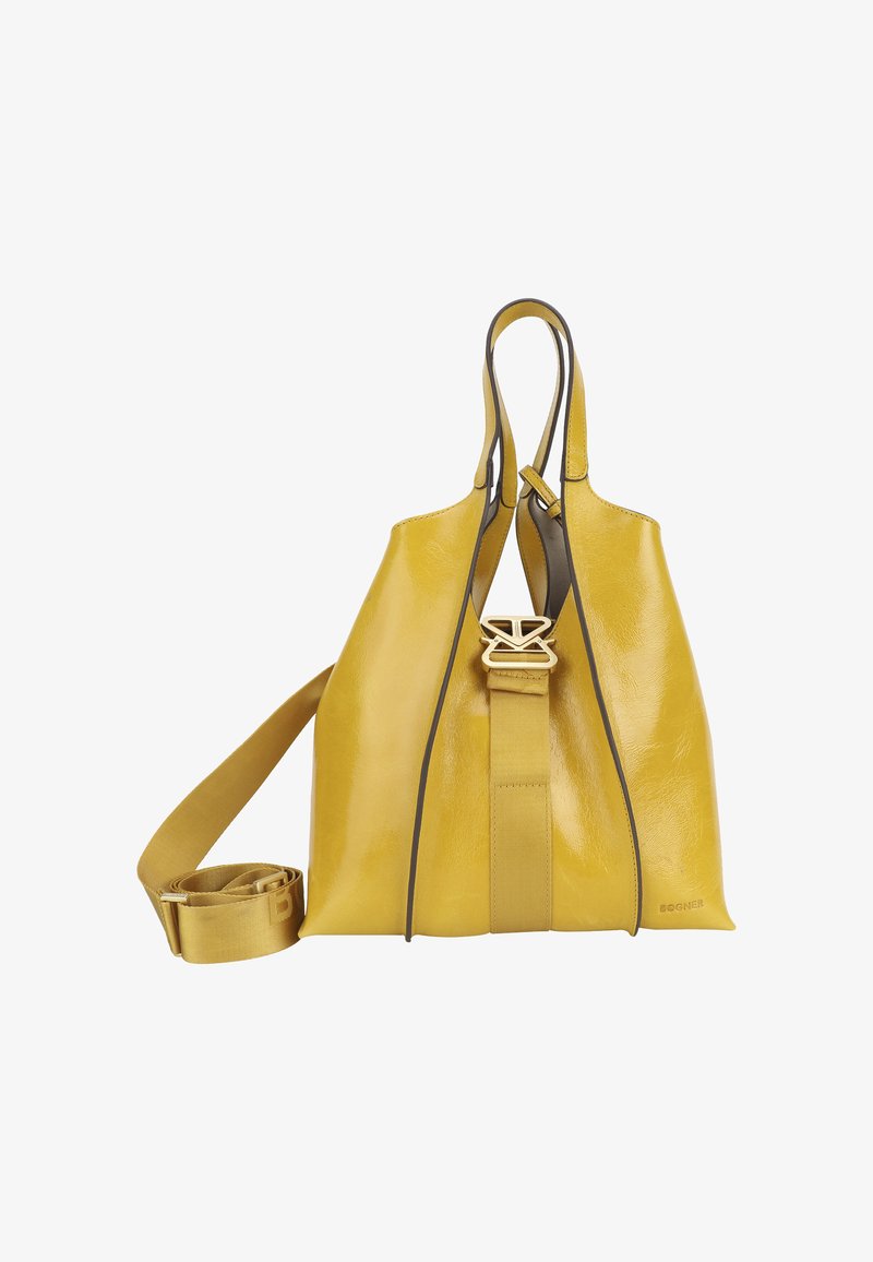 Żółta skórzana torebka o strukturalnym kształcie, z podwójnymi uchwytami, odczepianym paskiem i kontrastowym ciemnym wykończeniem. Zawiera wyraźny akcent logo.