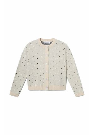 Cárdigan crema con lunares negros, cuello redondo, cierre frontal con botones y puños y dobladillo acanalados. Textura de punto suave.