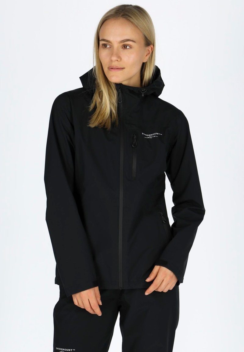 Black waterproof jacket with a fitted design, hood, zippered front, and logo detail on the chest. Smooth texture, suitable for outdoor use.