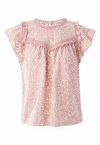 Rosa kurzärmlige Bluse mit weißen abstrakten Punkten, Spitzenbesatz über der Brust und rüschendetails an den Schultern.
