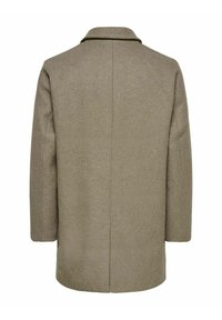 Khaki villasegusti mantel sirge lõike, lõigatud krae ja kahe külgseemega. Sile tekstuur, minimalismiga disain, nähtavaid kinnistusi pole.