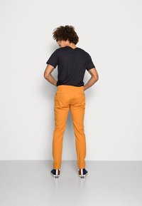 Levi's® XX CHINO SLIM TAPER PANTS - Chinos - golden oak