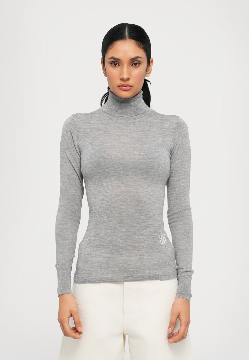 Gray turtleneck top made of a lightweight, fitted material, featuring long sleeves and a subtle logo detail at the hem.