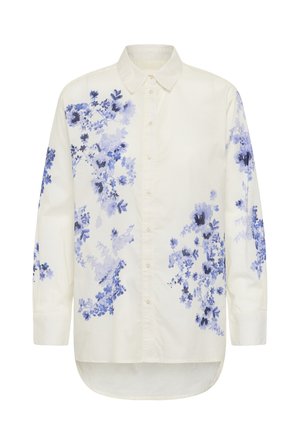 Chemise blanche à manches longues avec boutons, ornée de motifs floraux bleus et violets sur le devant, les manches et l'ourlet inférieur du dos.