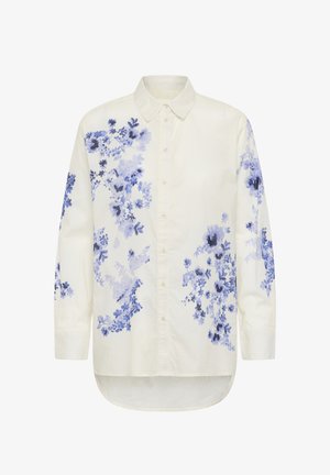 Bela srajca z dolgimi rokavi in gumbi, z modrimi in vijoličnimi cvetličnimi vzorci na sprednji strani, rokavih in spodnjem robu na zadnji strani.