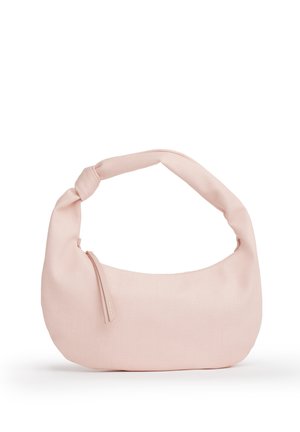 Borsa in tessuto rosa chiaro con manico annodato e chiusura con cerniera sul lato frontale sinistro su sfondo bianco.