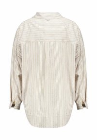 Loose-fit long-sleeve shirt with vertical and horizontal thin beige stripes and small dot pattern, shown from the back.