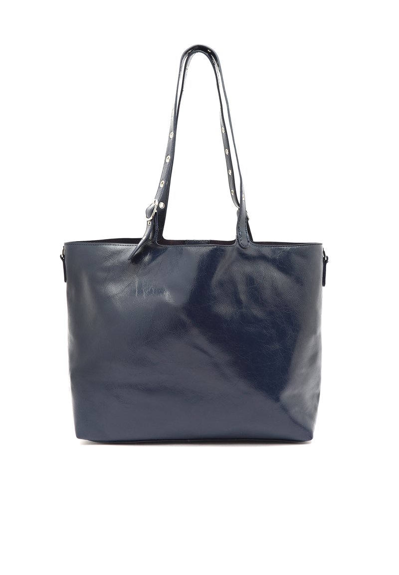 Laukun väri on tummansininen, se on valmistettu nahasta ja omaa sileän pinnan. Siinä on kaksi pitkää kahvaa sekä koristeellista hopeista metalliosaa kahvoissa. Sivussa on vetoketjullinen tasku.