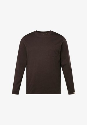 T-shirt a maniche lunghe marrone in cotone, con scollatura rotonda e una piccola tasca sul petto a sinistra. Morbido al tatto e senza fantasia.