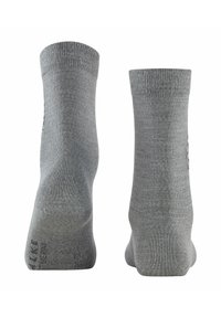 Calze di cotone grigie con bordo a costine e tallone rinforzato. Texture liscia con un sottile marchio vicino alla caviglia. Design classico di lunghezza alla caviglia.