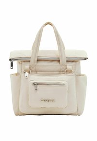 Beige nylon tote bag with a fold-over top, dual handles, multiple zipped pockets, and embossed logo. Smooth texture and minimalist design.