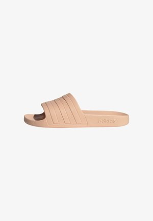 Peach-colored slide sandal with three horizontal stripes on the upper, made of textured rubber material; features embossed logo on side.