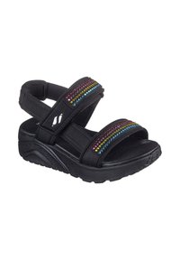 Sandalias negras con dos correas ajustables, decoradas con brillantes coloridos. Plantilla acolchada y suela de goma texturizada.