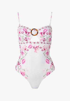 Maillot de bain une pièce blanc avec motif floral rose, fines bretelles, boucle ronde marron, et une petite découpe devant sous la poitrine.