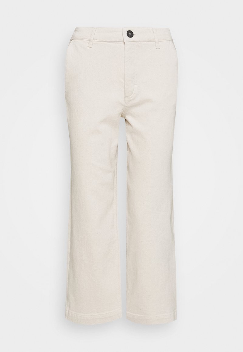 Beżowe spodnie o szerokich nogawkach wykonane z tkaniny z domieszką bawełny. Posiadają zapięcie na guziki z przodu, szlufki na pasek oraz dwie boczne kieszenie.