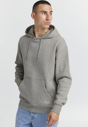 Gray pullover hoodie with a front pocket, drawstring hood, and ribbed cuffs. Made of soft, textured fabric for comfort.