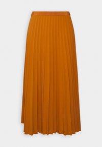 Jupe midi plissée de couleur moutarde riche, avec une ceinture douce et un tissu texturé présentant des lignes verticales marquées pour un mouvement accentué.