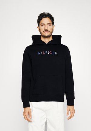 Felpa nera con cappuccio e tasca frontale, con logo "HILFIGER" ricamato in lettere multicolori. Texture morbida e vestibilità informale.