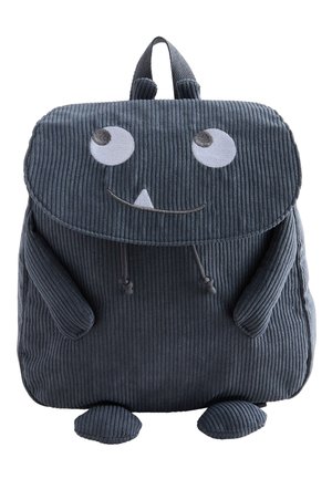 Donkergrijze corduroy kinderrugzak in de vorm van een glimlachend monster met grote ogen, kleine armen en voeten.