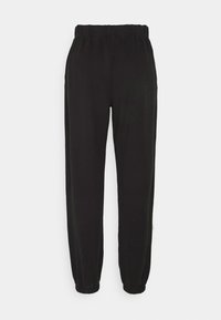 Svarta sweatpants med elastisk midja och ärmslut, med en slät textur och en avslappnad passform utan fickor.