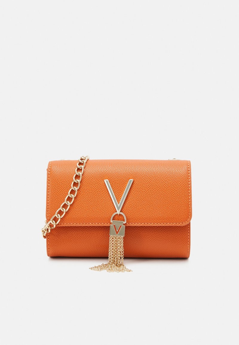Orange textured handbag with a gold chain strap, featuring a silver "V" clasp and chain tassel detail. Rectangular shape with a fold-over flap.