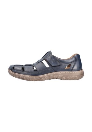 Navy blue leather sandal with open toe design, featuring cutouts, adjustable strap, and a textured brown rubber sole with grip patterns.
