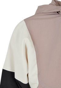 Färgsorterad jacka med en design i rosa, creme och svart. Tillverkad av mjukt, lättviktigt tyg med huva och kontrasterande sömnadsdetaljer.