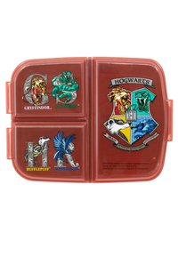 Lunchbox im Hogwarts-Design mit einem durchsichtigen roten Kunststoffexterieur. Vorne sind die Wappen der Häuser Gryffindor, Slytherin, Hufflepuff und Ravenclaw abgebildet.