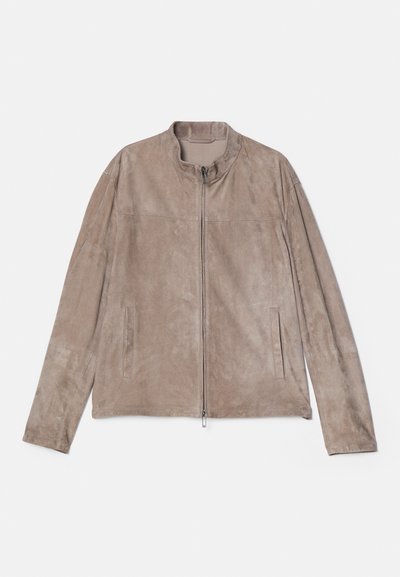 Suede beige jacket with a stand collar. Features a front zip closure, two side pockets, and straight-cut sleeves. Smooth texture throughout.
